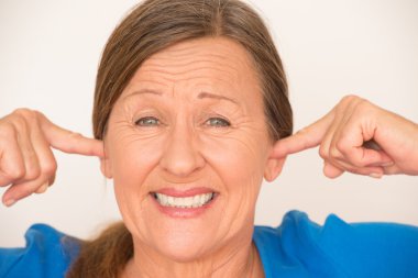 Noise Upset woman covering ears