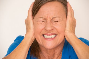 Woman in stress covering ears