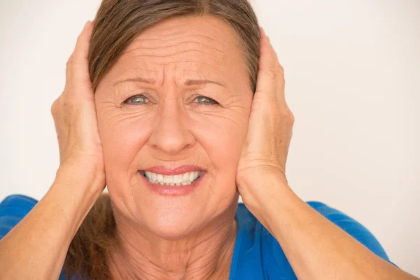 Woman headache covering ears — Stok fotoğraf
