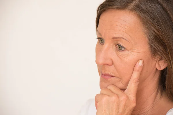 Worried mature woman thinking portrait — Stock fotografie