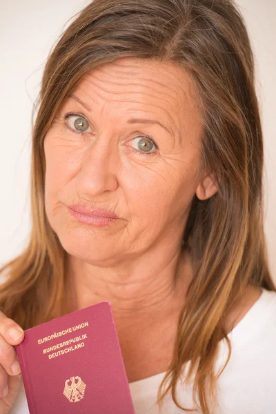 Sad woman with German passport — Stock fotografie