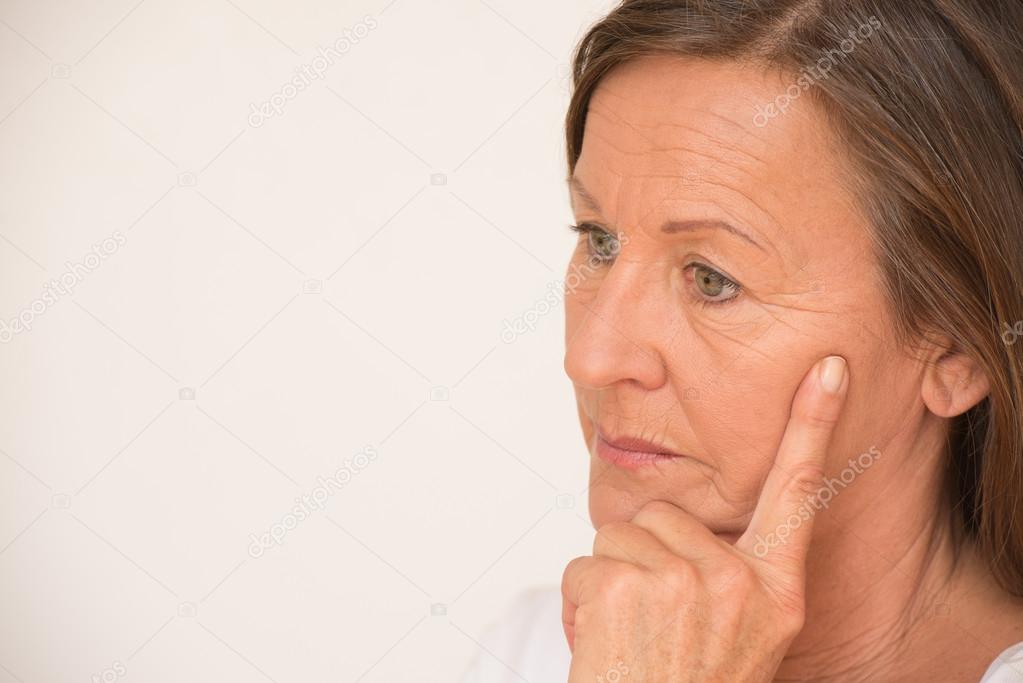 Worried mature woman thinking portrait