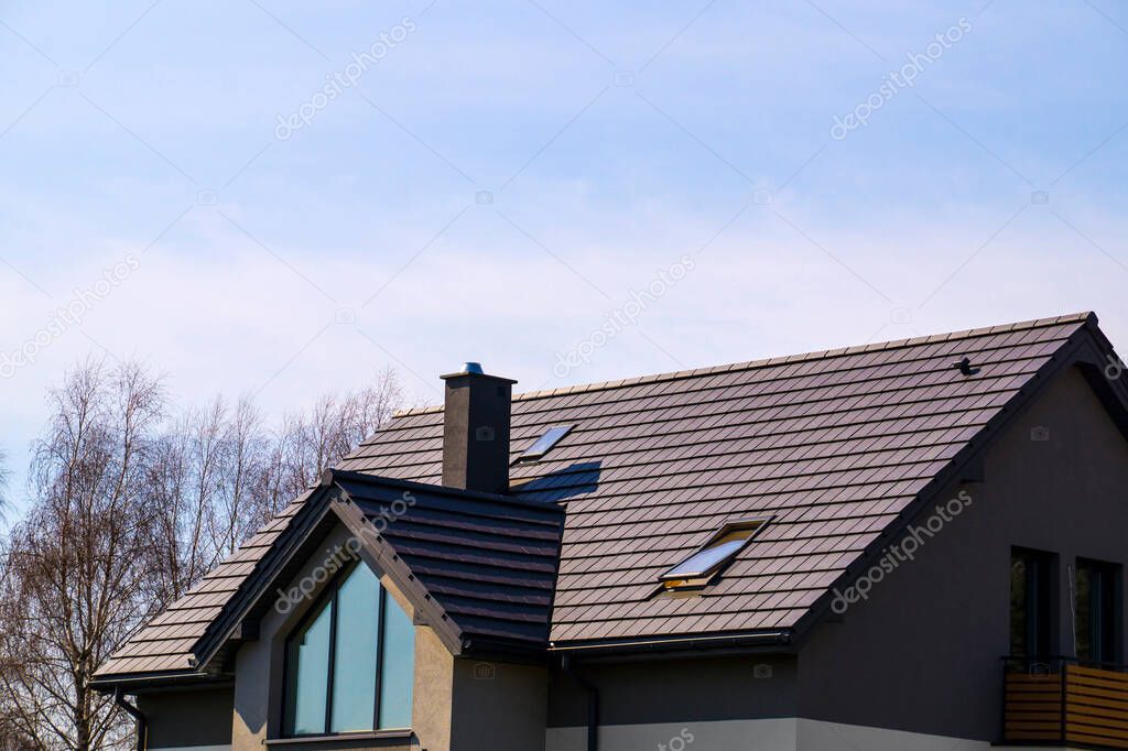 The roof is made of ceramic tiles. A newly built house.