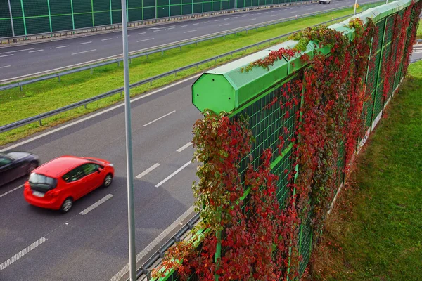 Noise barriers on the motorway. Barriers protect local residents from traffic noise.