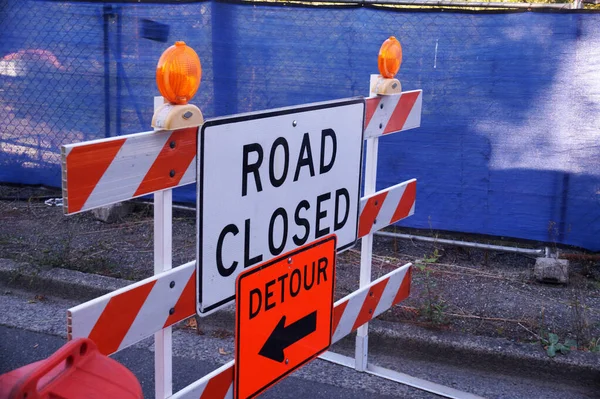 Road signs informing about road closures and detours. Road works.