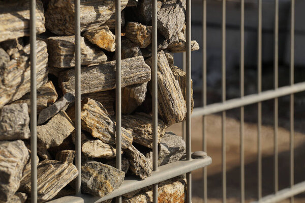 Gabion. Close-up on a steel, galvanized structure filled with spectacular pieces of rock.