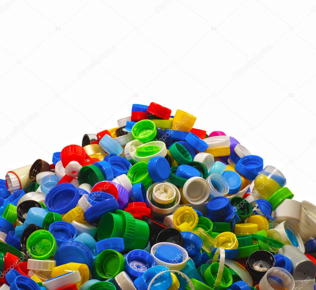 Heap of caps from plastic bottles. Secondary raw material, most often it is HDPE (High-density polyethylene).