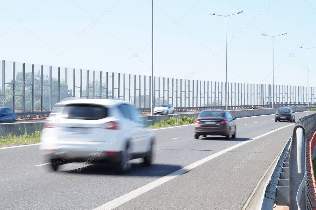 Noise barriers on the motorway. Barriers protect local residents from traffic noise.