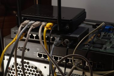 PC connections: router, switch and tangle of internet cables. clipart