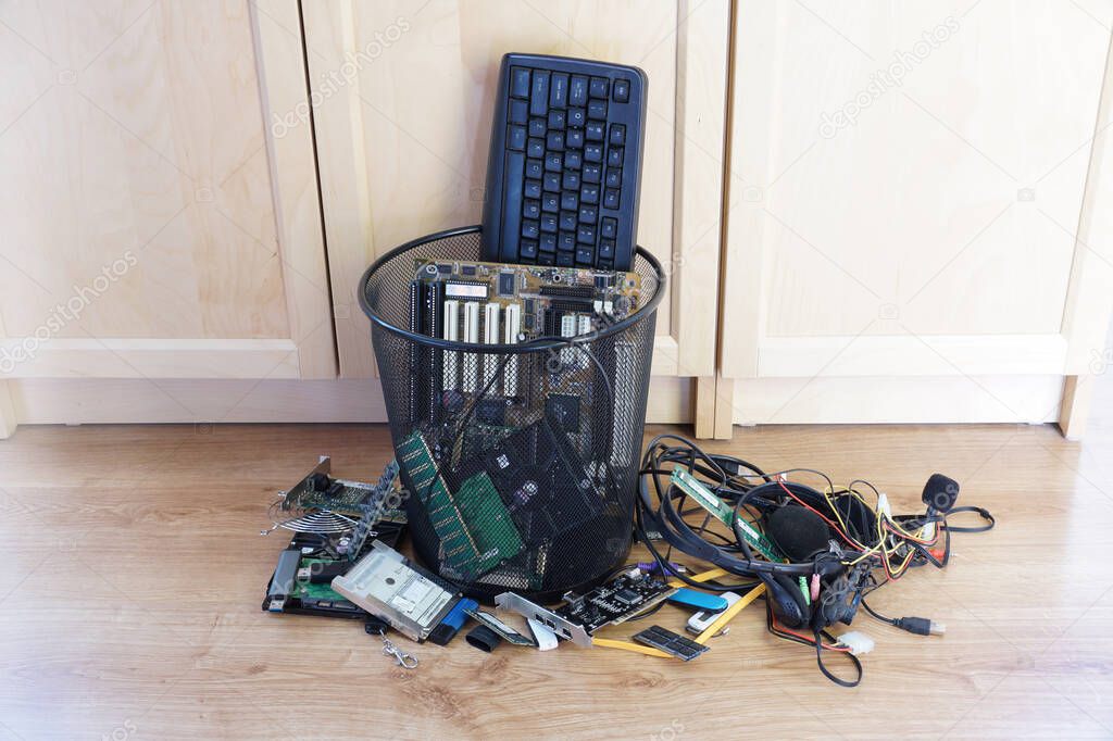 A trash bin filled with worn-out computer components. E scrap.