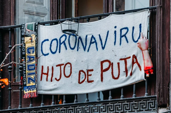 Sign translated into English to read Coronavirus Son of a Bitch with middle finger dummy — Stockfoto