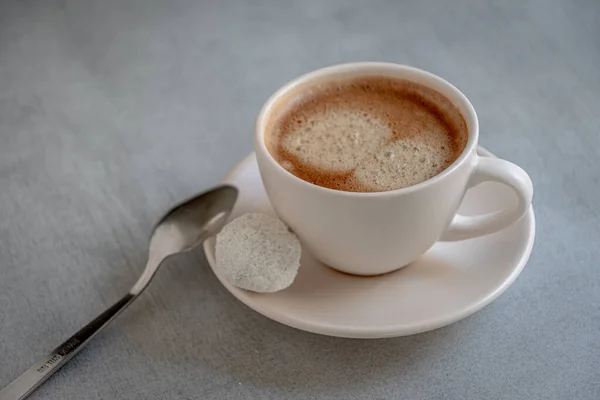 Cup Coffee Candy Saucer Metal Spoon Gray Background — Stok Foto