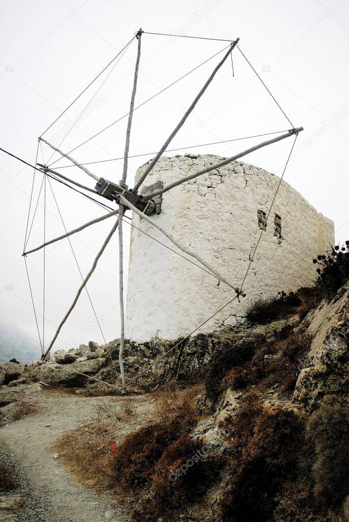 Old traditional windmill at Olympos village in Karpathos island, Greece.