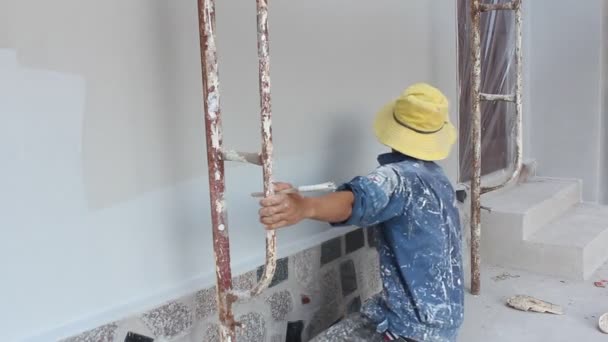 Painter painting wall in home — Stock Video