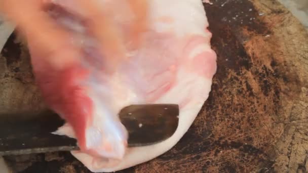 Pork processing with knife — Stock Video