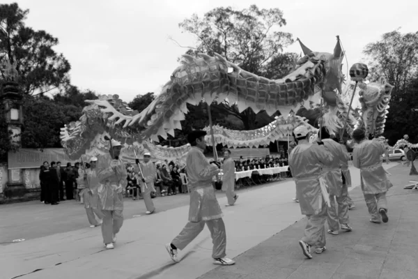 A group of Asian people dance dragon in folk festivals — Stock Photo, Image
