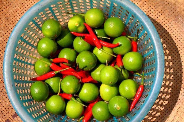 The lemon and chillis in the basket — Stock Photo, Image
