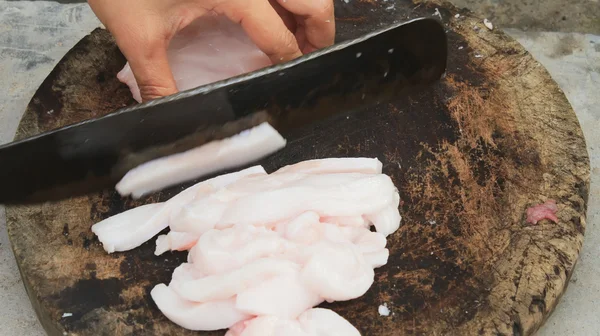 Cut meat with a knife — Stock Photo, Image