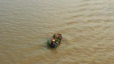 Fishermen catch fish in the river