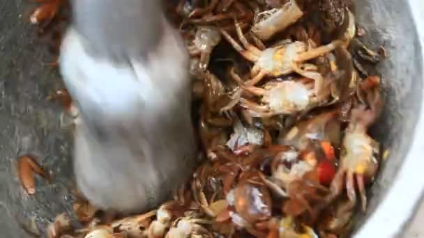 Processing food from shrim and crab by mortar and pestle — Stock Video