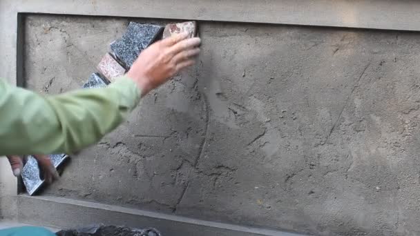HAI DUONG, VIETNAM, OCTOBER, 12: worker install stone wall surface with cement on October, 12, 2014 in Hai Duong, Vietnam — Stock Footage HAI DUONG, VIETNAM, OCTOBER, 12: worker install stone wall surface with cement on October, 12, 2014 in Hai Duong, Vietnam Stock Video