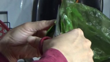February 09, 2026. Chu Van An, Hai Phong, Vietnam. Betel leaves and areca nuts. the woman preparing betel nuts