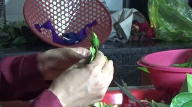 February 09, 2026. Chu Van An, Hai Phong, Vietnam. Betel leaves and areca nuts. the woman preparing betel nuts