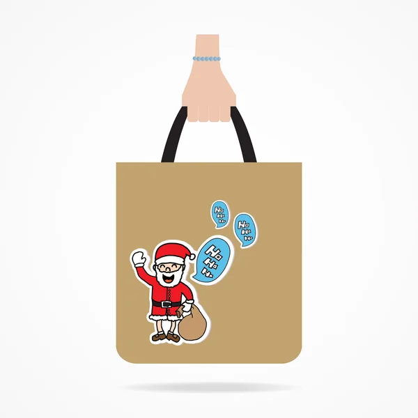 Mão com saco de compras de Natal . — Vetor de Stock