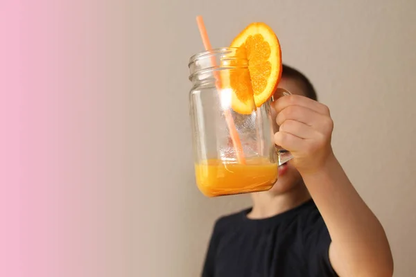 Cheerful Kid Boy Holds Glass Jar His Hand Orange Juice — Stock Photo, Image