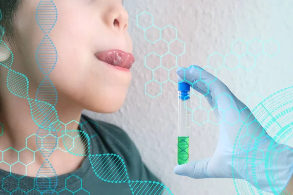 child, kid 7-8 years old sits with his mouth open, tongue sticking out, scientist\'s hand with test tube, concept of scientific research, covid test, saliva dna determination, paternity, family tree