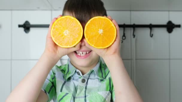 Child Kid Boy Sitting Kitchen Home Juicy Yellow Oranges Instead — Stock Video