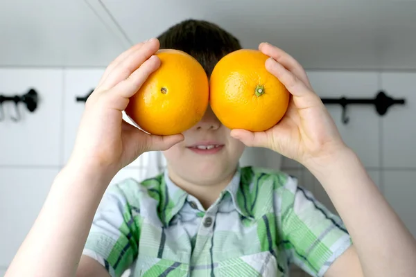 Child Kid Boy Sitting Kitchen Home Juicy Yellow Oranges Instead — Stock Photo, Image