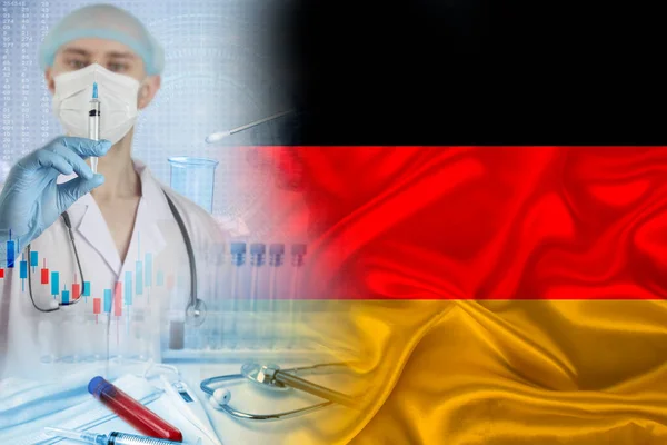 national flag of Germany on satin, a doctor with a syringe, the concept of vaccination of the country\'s population, the development of medical, the fight against the coronavirus covid-19