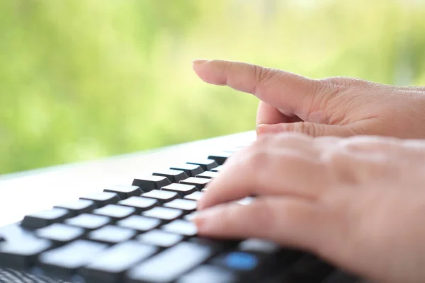 Close Female Hand Typing Text Computer Keyboard Natural Background Workplace — Stock Photo, Image