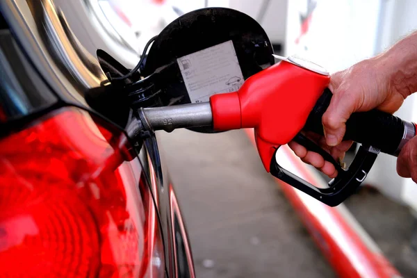 Close Male Hand Holding Red Refueling Gun Refueling Car Internal — Stock Photo, Image