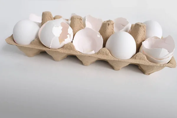 close-up of a tray of white eggs on white table, the concept of buying products for the home, an ingredient for home cooking, paint Easter eggs