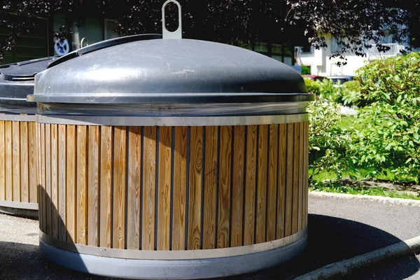 waste containers for separate sorting at a public urban waste collection site in the courtyard of an apartment building in France, concept of cleanliness, recycling and disposal of household waste