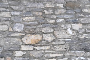 14. yüzyılın ortalarında inşa edilmiş bir ortaçağ şatosunun güzel klasik dokusu. Tasarımcı, duvar kâğıdı ve arka plan için çok renkli hacimsel taşlar.