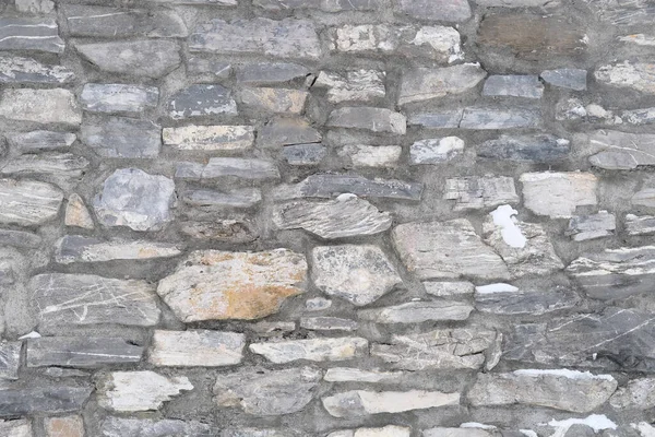 14. yüzyılın ortalarında inşa edilmiş bir ortaçağ şatosunun güzel klasik dokusu. Tasarımcı, duvar kâğıdı ve arka plan için çok renkli hacimsel taşlar.