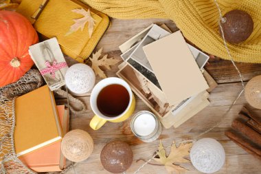 Exotic Tropical cocktail with red drink, orange spiral straw, wine glass with crimson beverage with orange slice, hibiscus flower, seashells nearby, ocean sunset background, vacation paradise 