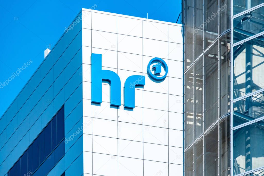 Modern building facade, hr logo, ARD 1 emblem, set against blue sky, European public broadcaster, German telecommunications, headquarters media Hessischer Rundfunk in Frankfurt - October 1, 2025