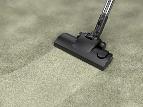 Vacuum cleaner cleans dirty carpet — Stock Photo, Image