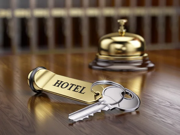 Hotel key and reception bell — Stock Photo, Image