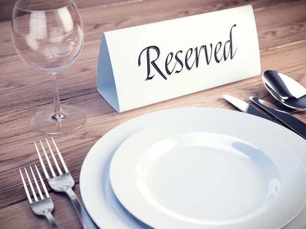 Reserved sign on a restaurant table - 3d render — Stock Photo, Image