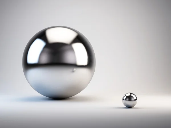 Concepto grande y pequeño. esferas grandes y pequeñas — Foto de Stock