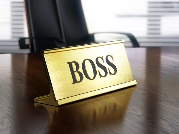 Targhetta Boss su tavolo in legno — Foto Stock