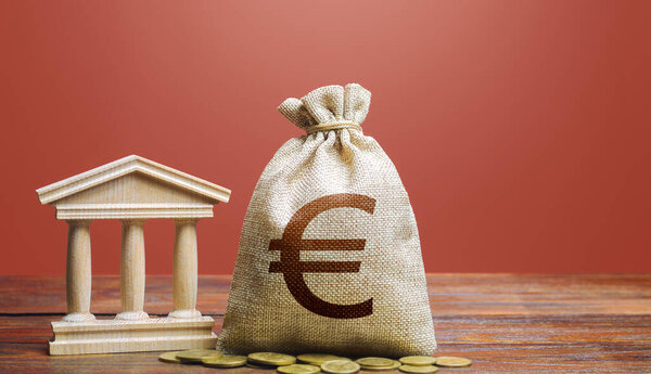 Euro money bag and bank / government building. Tax collection and budgeting. State debt. GDP and GNP. Monetary policy. Support businesses in times of crisis. Lending loans, placing deposits.
