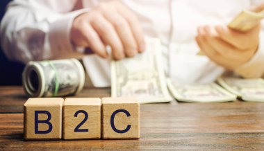 B2C ve işadamı kelimesiyle tahta bloklar. İşletmeden tüketiciye. Organizasyon ve son kullanıcılar arasındaki ticari ilişki. Tüketicilere doğrudan satış. Modern iş süreçleri kavramı