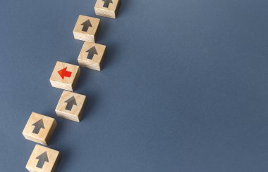 Red arrow stands out from the others and changes direction to go out of order. Thinking outside the box. New strategies and solutions. Atypical, leadership qualities. Denial of conformism.