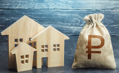 Rus rublesi para çantası ve konut binalarının heykelcikleri. Emlak vergisi. Yatırım çekiciliğini arttır. Kentsel kalkınma ve altyapı projelerinin finansmanı. Ekonomik Konut Programı.